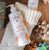 Babo Botanicals- Sensitive baby Shampoo & Wash- Holiday background with a white stocking